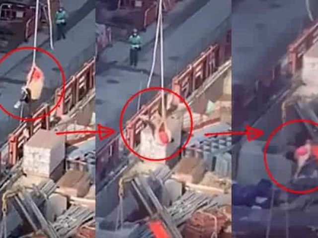 construction worker dangling from crane hongkong