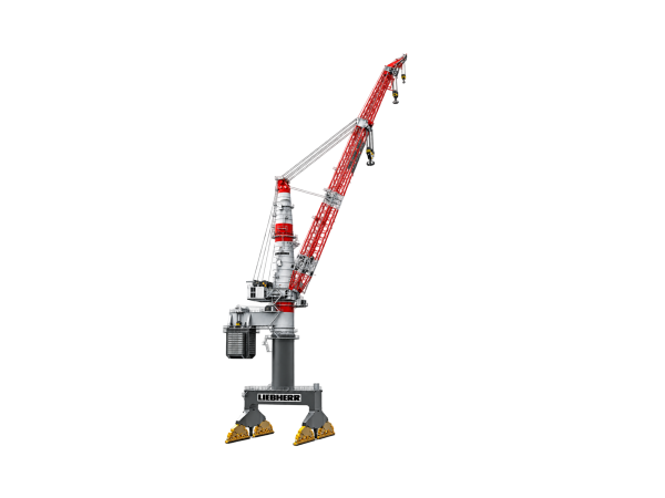 Side profile of a Liebherr TCC 78000 heavy-lift pedestal crane with red and white lattice boom