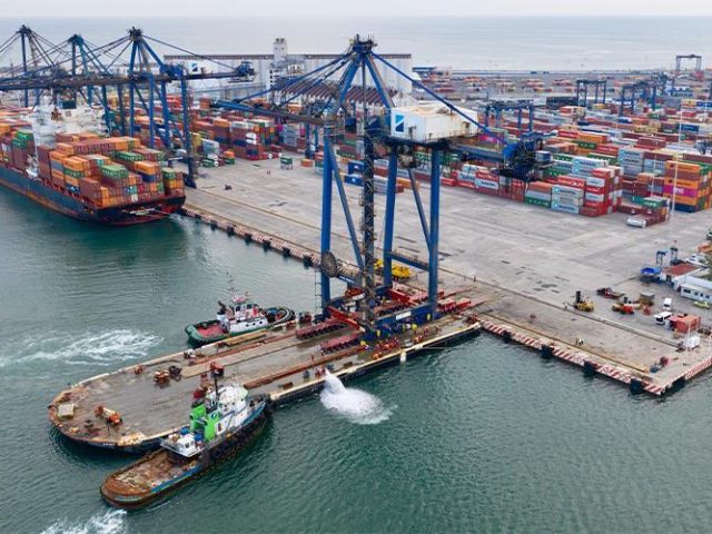 Mammoet moving container cranes in port in Mexico.